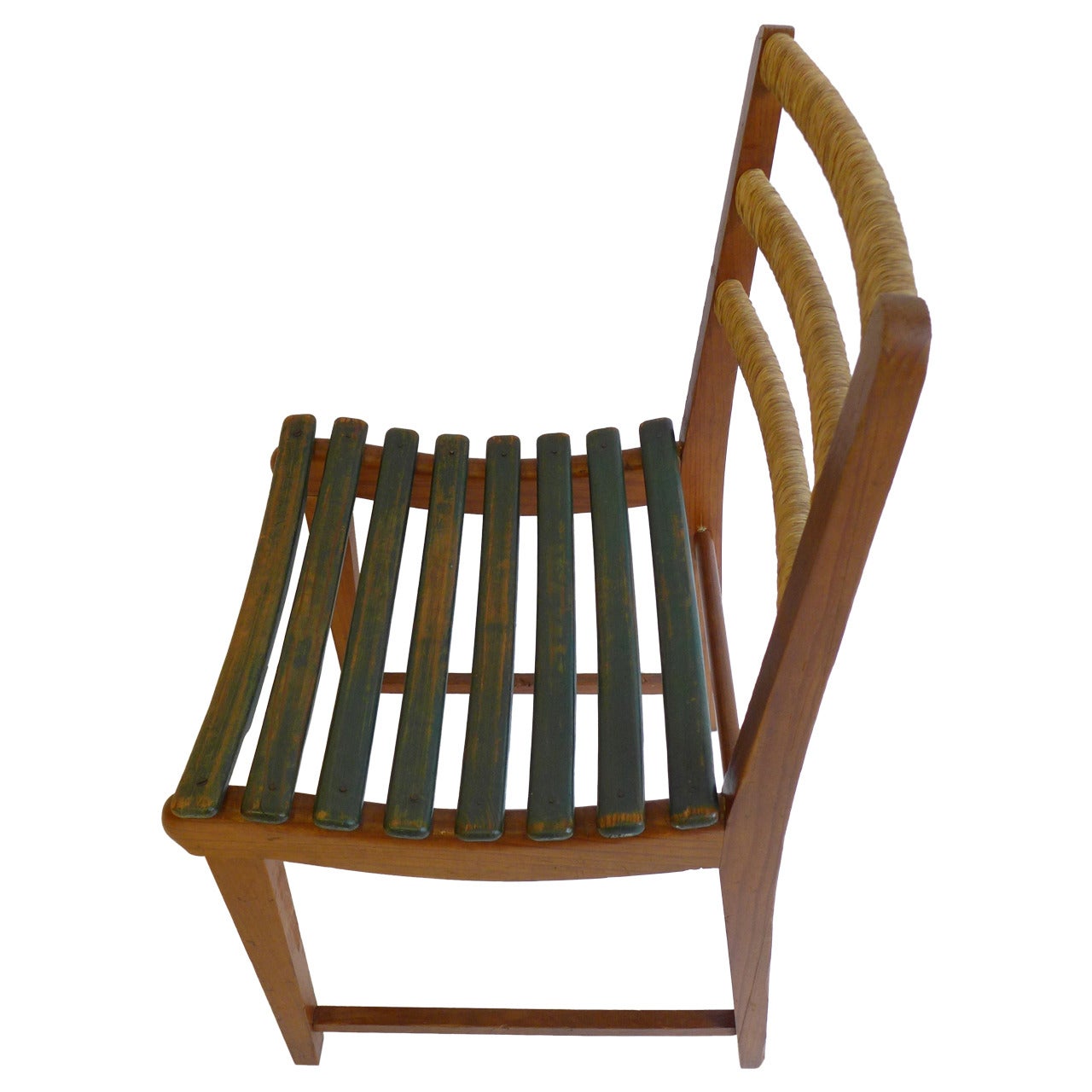 Modernist chair of pine with curved and painted wood slats and rush-wrapped back rails. Designed by Michael van Beuren for his company, Domus, and produced in Mexico, circa 1947. Born in New York City, van Beuren (1911-2004) studied at the Bauhaus