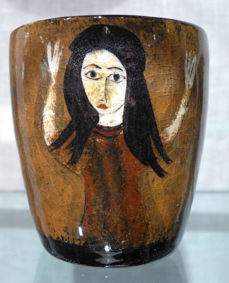 Small but nice cup with a painterly figure by Polish-born American potter and artist Polia Pillin (1902-1992).  Known for her hand-thrown vessels with figural abstractions and Chagall-like colors, Pillin's reputation has been burnished by the recent