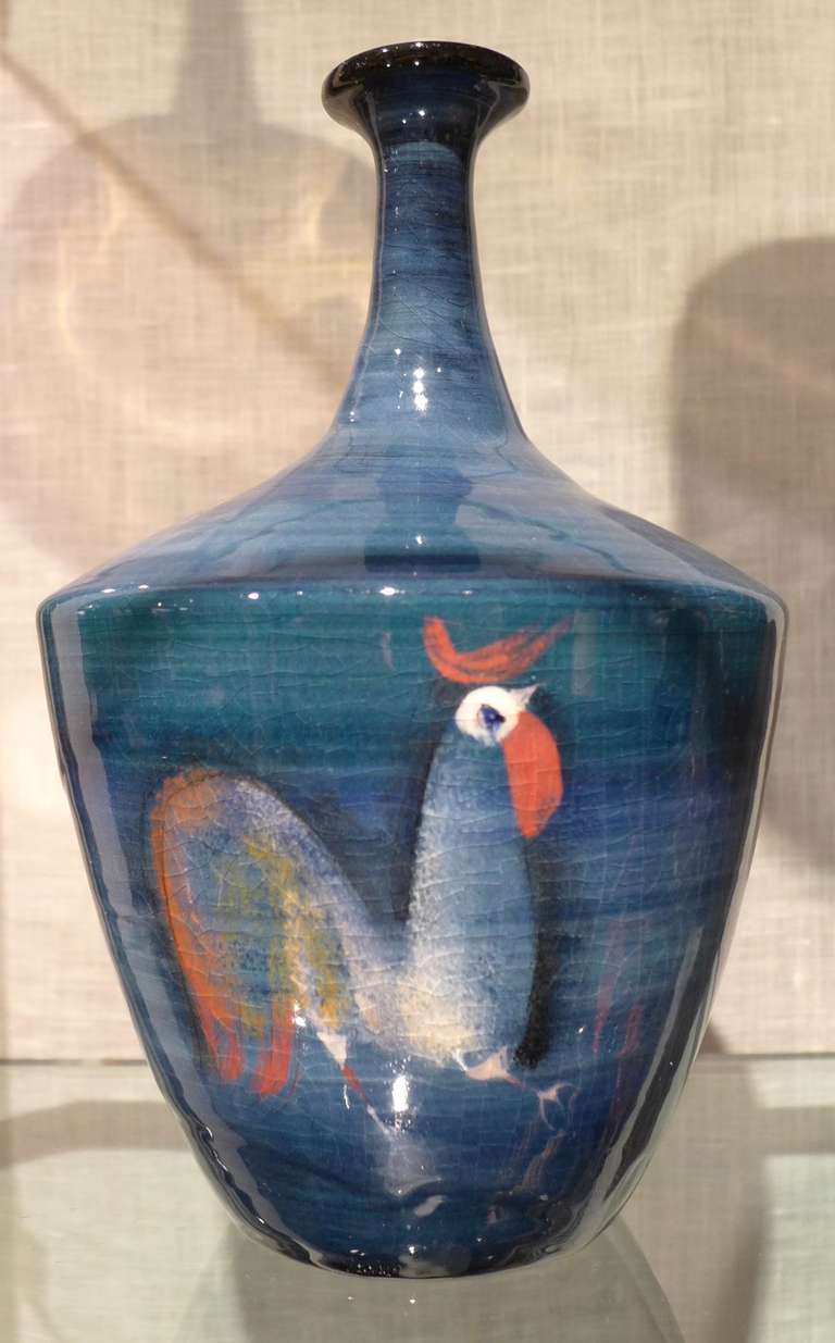 Bottle form with three painted roosters by Polish-born American painter and ceramist Polia Pillin (1902-1992). Known for her hand-thrown vessels with figural abstractions and Chagall-like colors, Pillin's reputation has been burnished by the recent