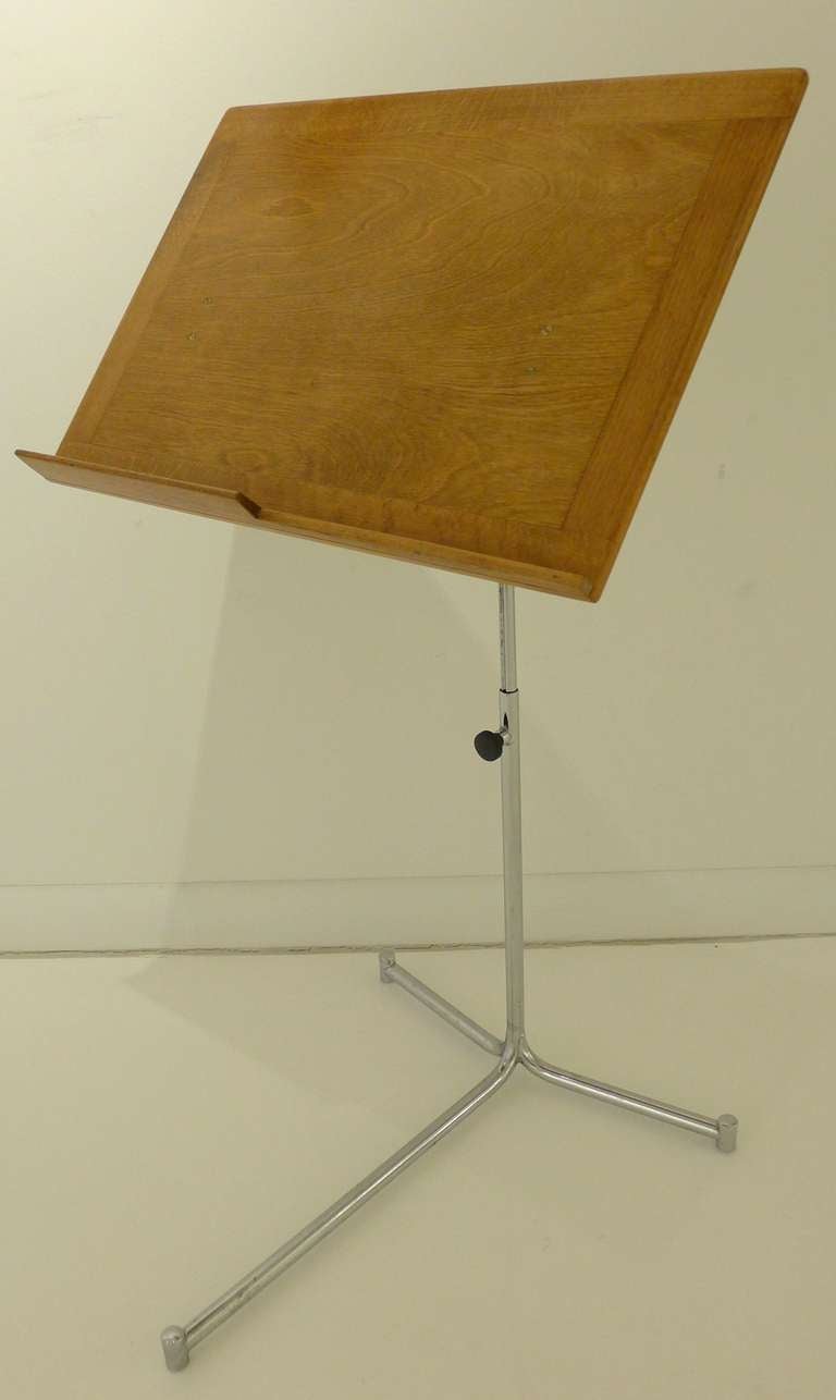 Adjustable book stand of birch, oak, and nickel-plated steel, produced by Firma Karl Mathsson, c. 1950's.  A rare companion piece to Mathsson's webbed chairs. Burned maker's marks.