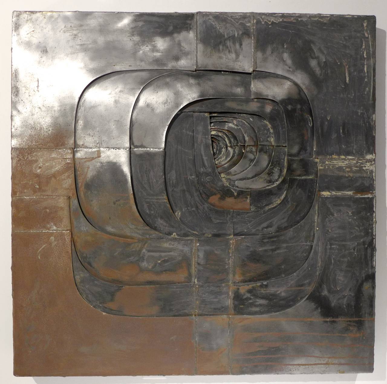 Brutalist wall sculpture of collaged, textured, and over painted steel by Spanish sculptor, painter, and graphic artist Amadeo Gabino, executed circa 1965. Gabino (1922-2004) trained at the Royal Academy of Fine Arts of San Carlos from 1939 to 1944,