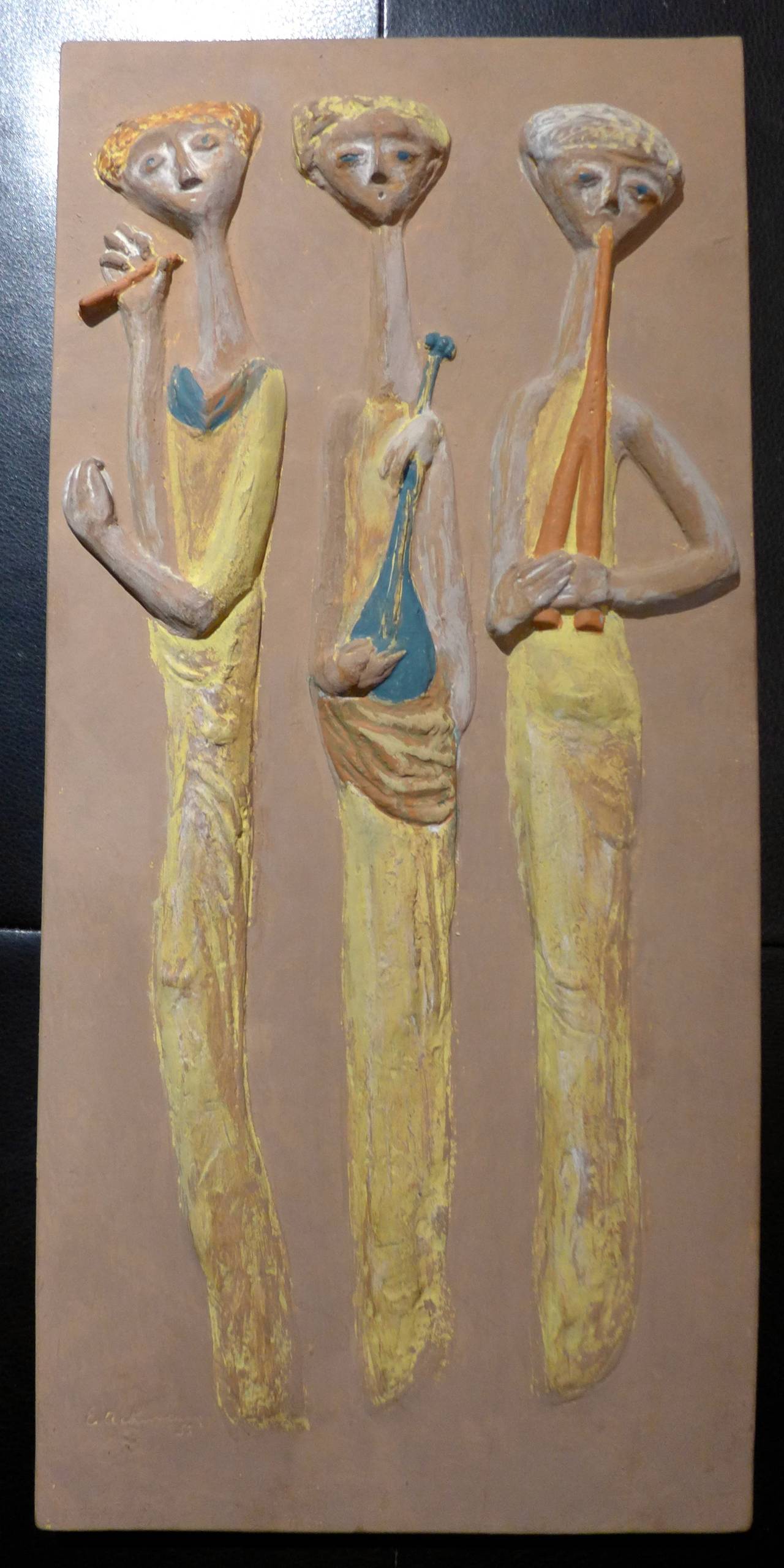 Wall plaque of hand-painted hydrostone (a hard plaster) by California designer and artist Evelyn Ackerman, signed and dated 1955. A rare Ackerman work in this material, done before the later success of Era Industries, her design business with