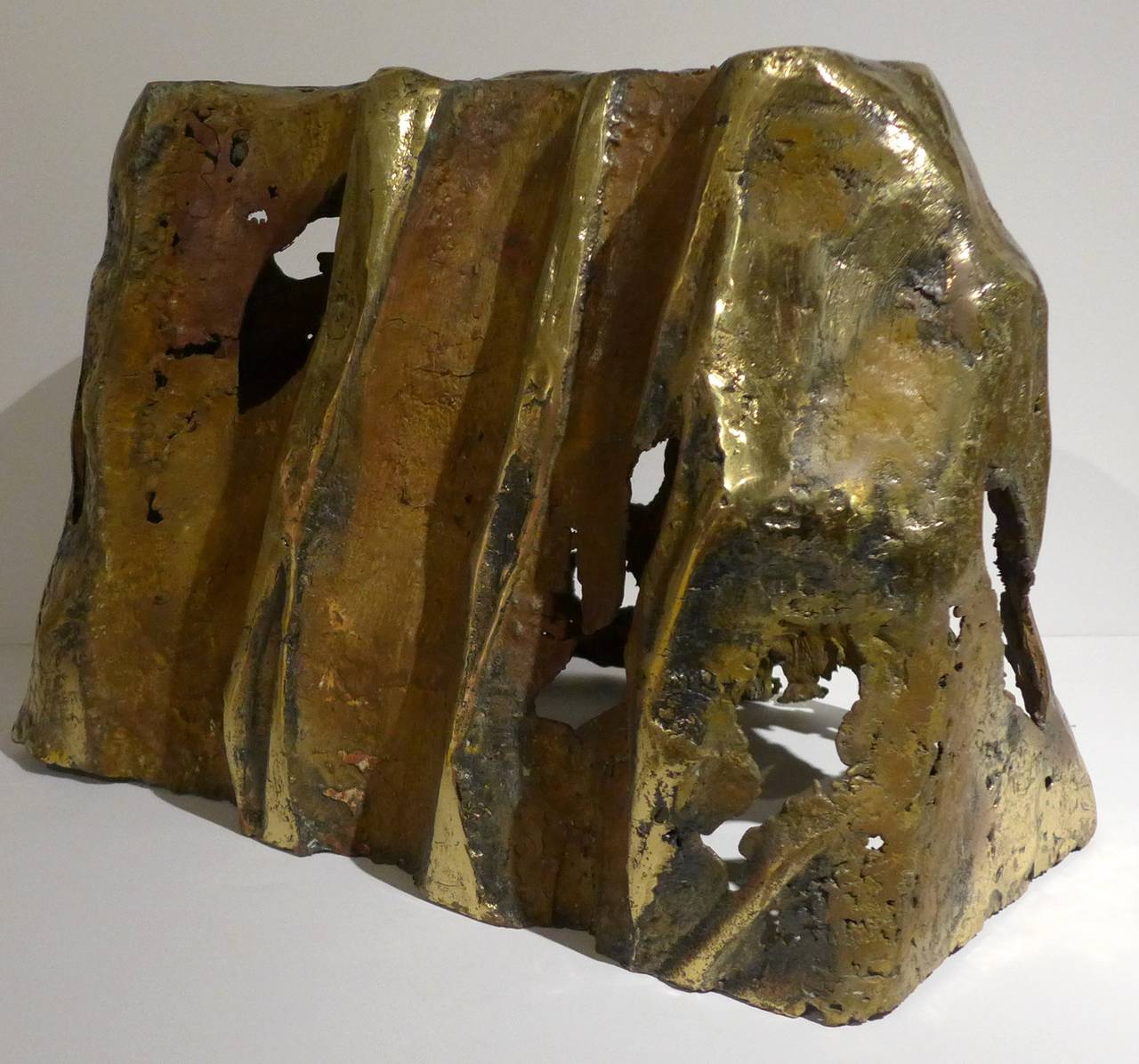 Brutalist sculpture of cast, welded, torch-cut and textured bronze, executed circa 1960s. Interesting and variegated surface. In the manner of Philip and Kelvin LaVerne or Silas Seandel. Can be used as a side table by adding a glass top.