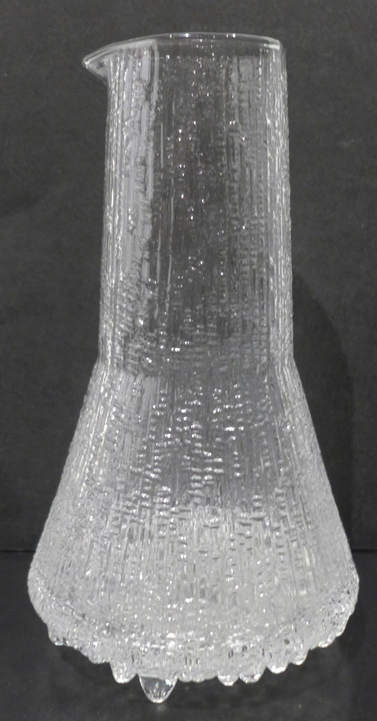 Mold-blown glass carafe designed by Tapio Wirkkala and produced by Iittala, Finland, c. 1970's.  From the Ultima Thule line, inspired by the structure of ice.
In excellent original condition.