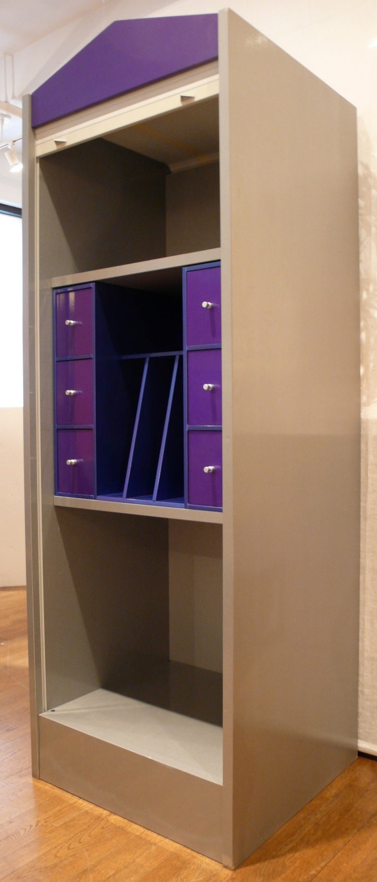 Post-modern cabinet with plastic tambour door by Driade co-founder Antonia Astori. Produced as part of the 