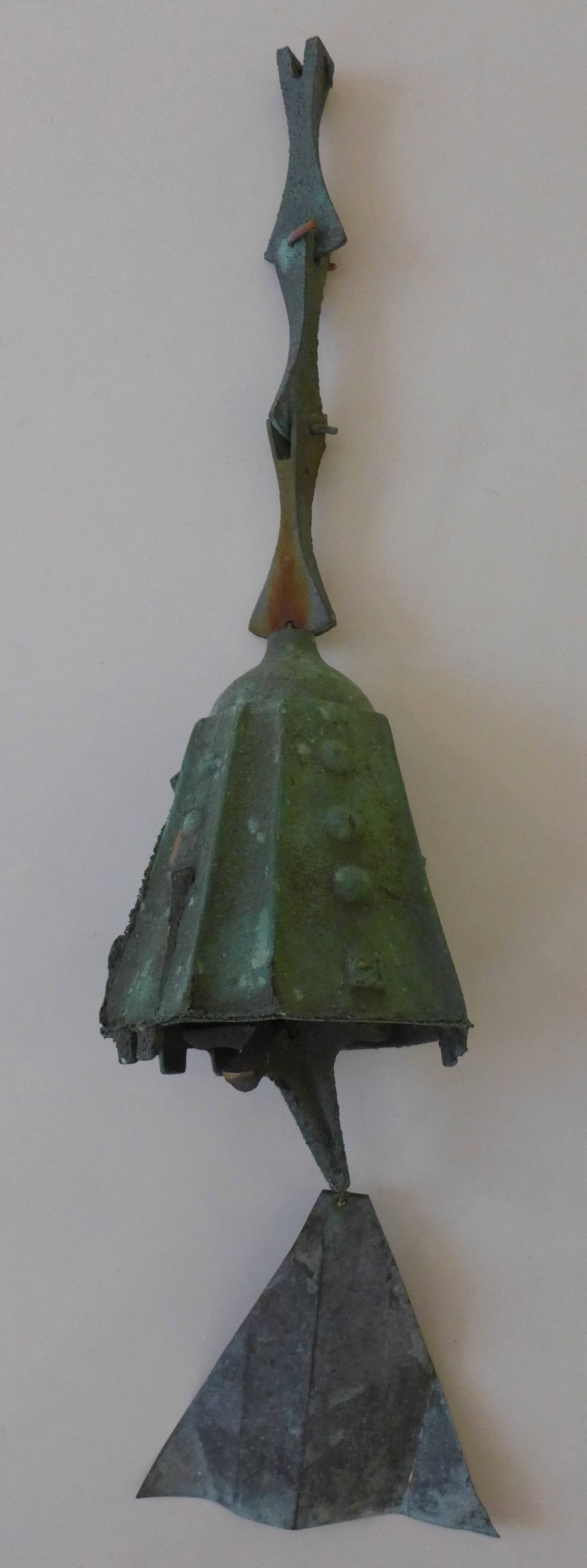 Two cast bronze wind bells designed by Paolo Soleri and produced at Arcosanti, c. 1970's.  The larger measures 5