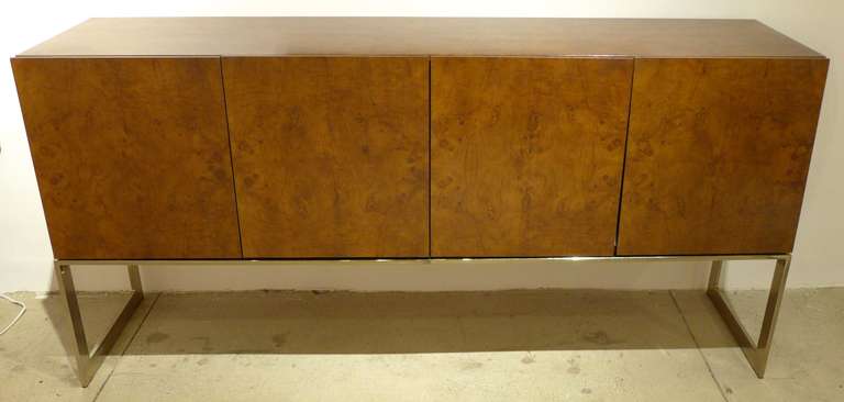 Burled walnut sideboard with chrome base designed by Milo Baughman and produced by Thayer-Coggin, c. 1960's.  In fine vintage condition with only minimal wear consistent with age and use.