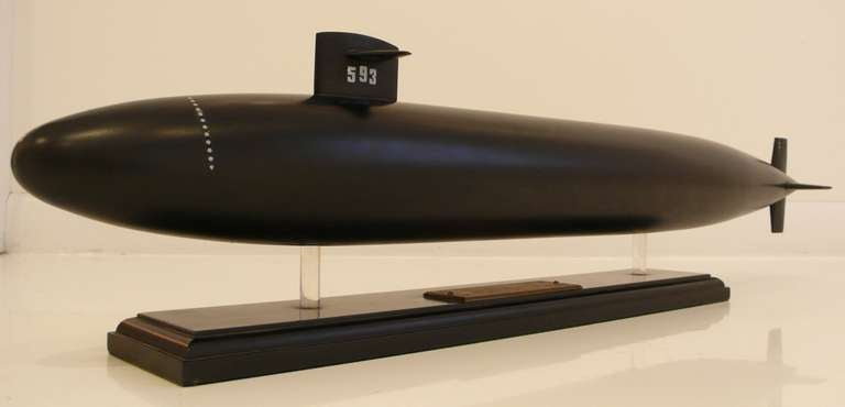 Hand-carved and painted wooden model of the nuclear submarine Thresher, likely a presentation model, bearing an engraved copper plaque from the Portsmouth Naval Yard, where it was built. The Thresher was launched in 1960, as the first nuclear