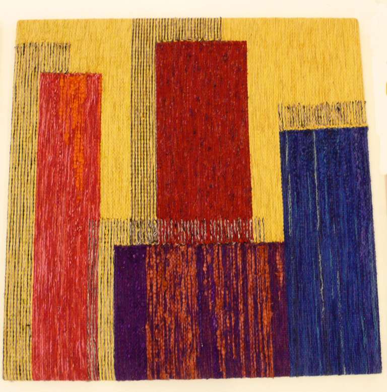 Three part hand-woven textile with a geometric abstract pattern by Julienne Krasnoff, a Long Island weaver and author of books about weaving.  Done c. 1960 for her own house. Each panel measures 46