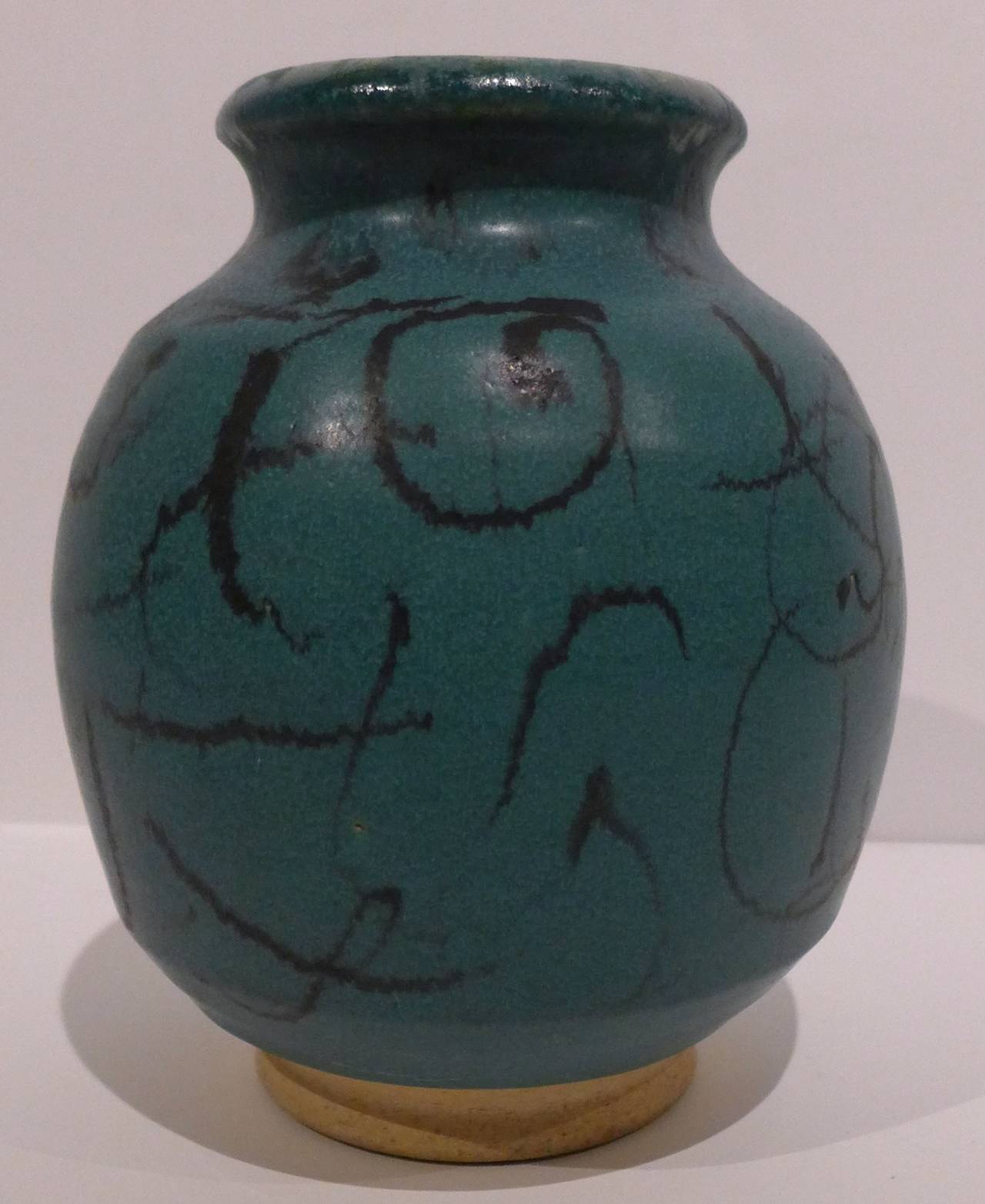 Bulbous stoneware vase with unglazed foot and flaring rim, with abstract painted pattern in the glaze. By renowned American ceramic artist Antonio Prieto (1912-1967). After studying at Alfred University, Prieto moved to California, where he taught