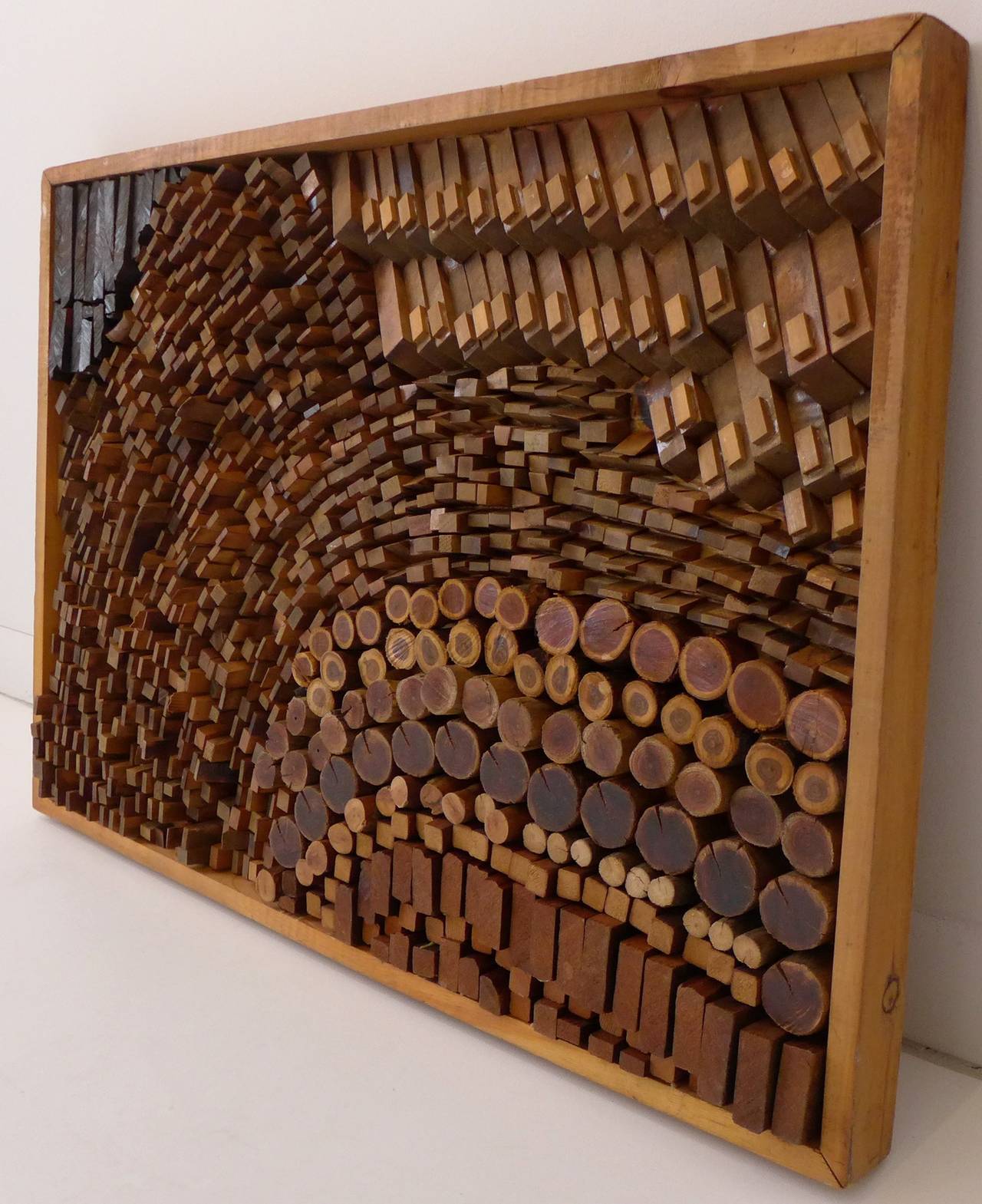 Abstract wall relief of sawn, stained, and collaged wood and found wood objects, by Lithuanian-born American artist Josef Twirbutt. A practicing architect as well as artist, Twirbutt arrived in New York City in 1959 and plugged into the Village art