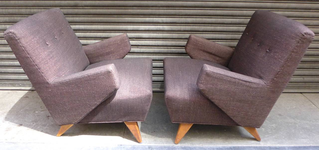 Pair of lounge chairs or club chairs with rakishly linear arms and legs, designed by Jens Risom. Part of the H.G. Knoll Associates catalog of 1946. The fabric, which is holding up well, was re-done in the past ten years or so.