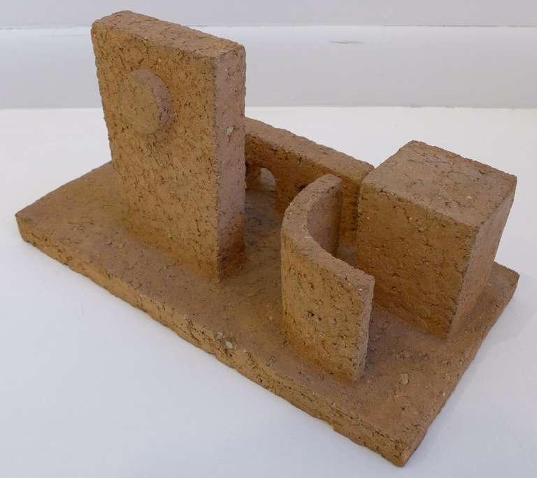 Architectural sculpture in terra cotta of four geometric structures in spatial relationship by NYC artist Sidney Geist (1914-2005). Geist, who studied with William Zorach and Jose de Creeft in New York before WWII, and with Ossip Zadkine in Paris