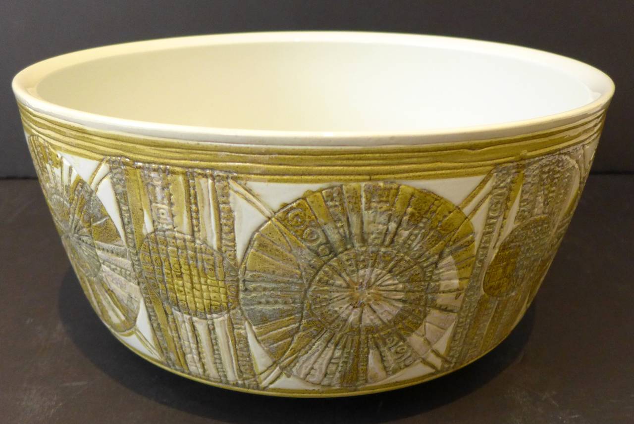 Large footed faience bowl with raised, incised and glazed decorative frieze, by Danish ceramist Kari Christensen Kroese. Made by Royal Copenhagen, circa 1970. Can also be used as a planter. Fully marked. In fine original condition.