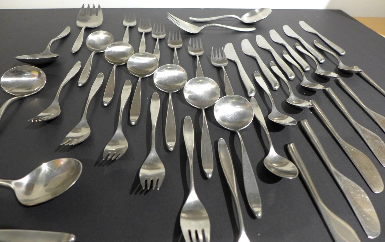 Six piece service for six, plus seven serving pieces, of Design 2, an iconic flatware set by American industrial designer and design critic Don Wallance (1909-90). Introduced in 1957, Design 2 enjoyed a 25 year production run. It was sold through