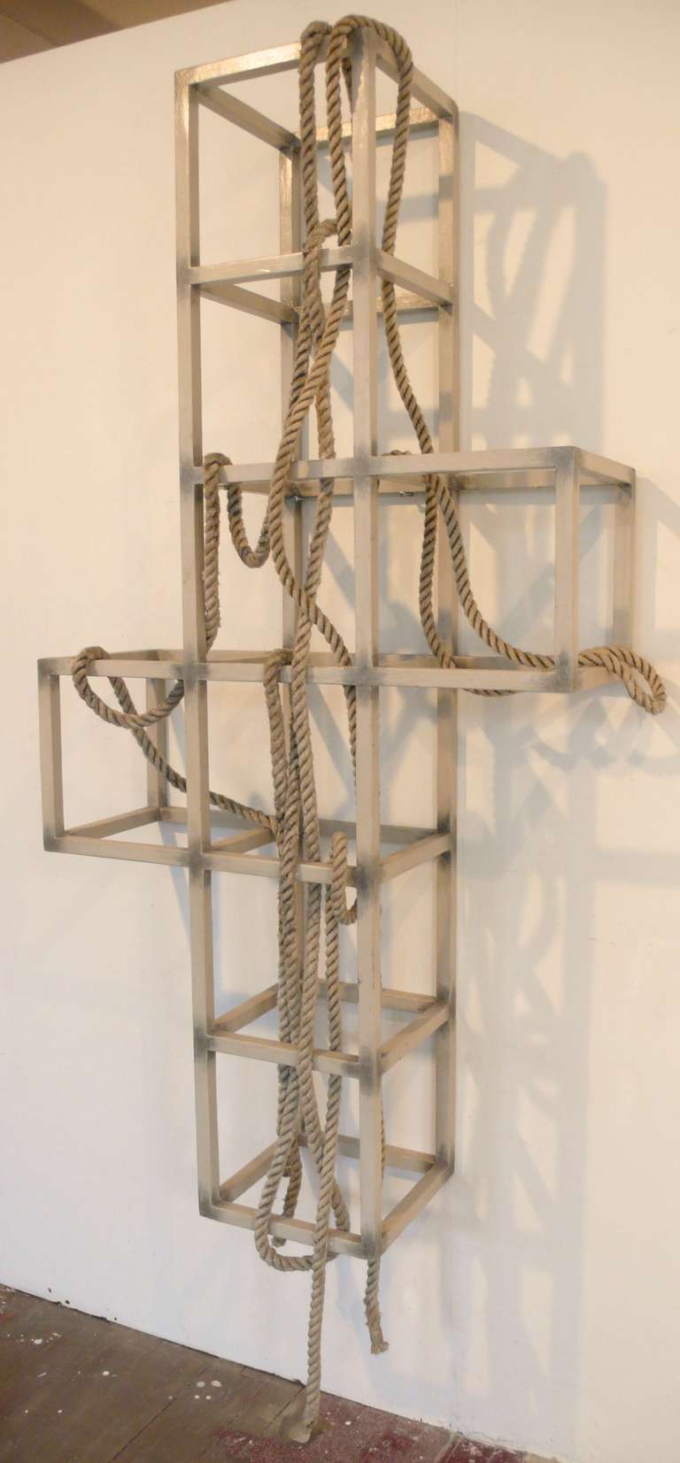 Wall-mounted sculpture by NYC artist Gabriele Roos, executed c. 2000. Roos studied art at the Cooper Union (BA,1953), the Art Institute of Chicago (BFA, 1956), and the Universtiry of Michigan (MFA, 1958) before completing her studies at NYU. She has