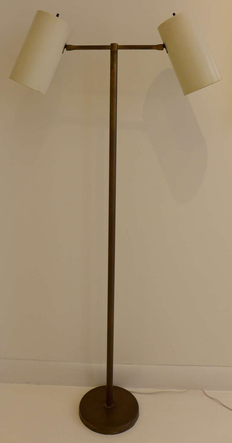 Floor lamp with two swiveling reflectors mounted on a T-shaped armature produced in the early 1960's by Nessen Studios.  A handsome but rarely seen work by one of America's premiere lighting manufacturers.  Rewired.  Ref:  Furniture Forum, v. 15