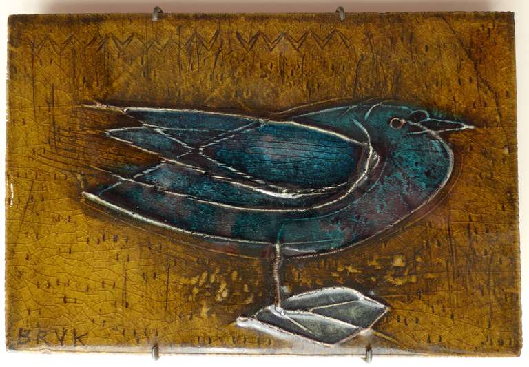 Stoneware plaque with bird motif by Finnish ceramic artist Rut Bryk (1916-99).  Hand-made at Finland's Arabia factory, c. 1950's.  Signed front and back.  An excellent example of Bryk's earlier, figurative work in immaculate original condition.  In