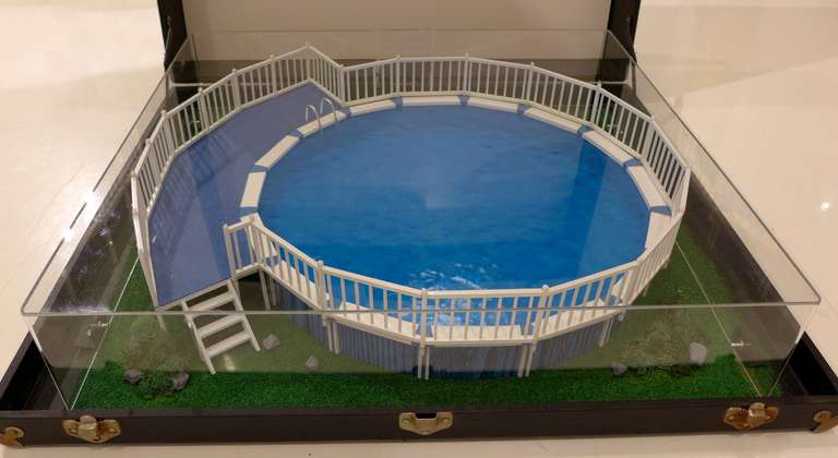 Salesman's sample of an above-ground swimming pool produced by Sears in the 1960's.  The plastic model under an acrylic box is affixed inside a leatherette-bound suitcase.  With two pieces of promotional material on foam core.  Made by Monte