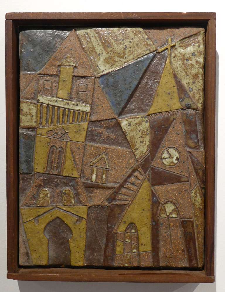 Ceramic relief plaque of incised and partially glazed stoneware by Manhattan Beach, CA ceramist Frank Matranga, c. 1970's. The cubistic village scene riffs on Lyonel Feininger's woodcuts from the 1920's.  Matranga studied with California potters