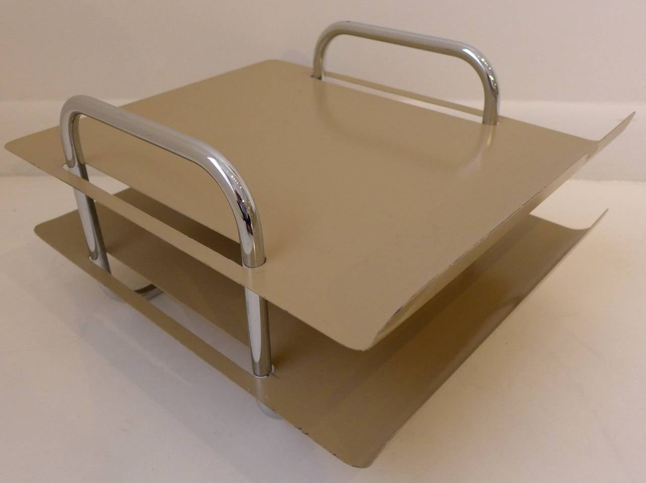 Two-tiered letter tray of tubular chrome and enameled steel, made by Peter Pepper Products of Compton, California, circa 1960s. A seldom-seen design that has an Industrial feel with visual flair. In fine original condition, with some paint loss and