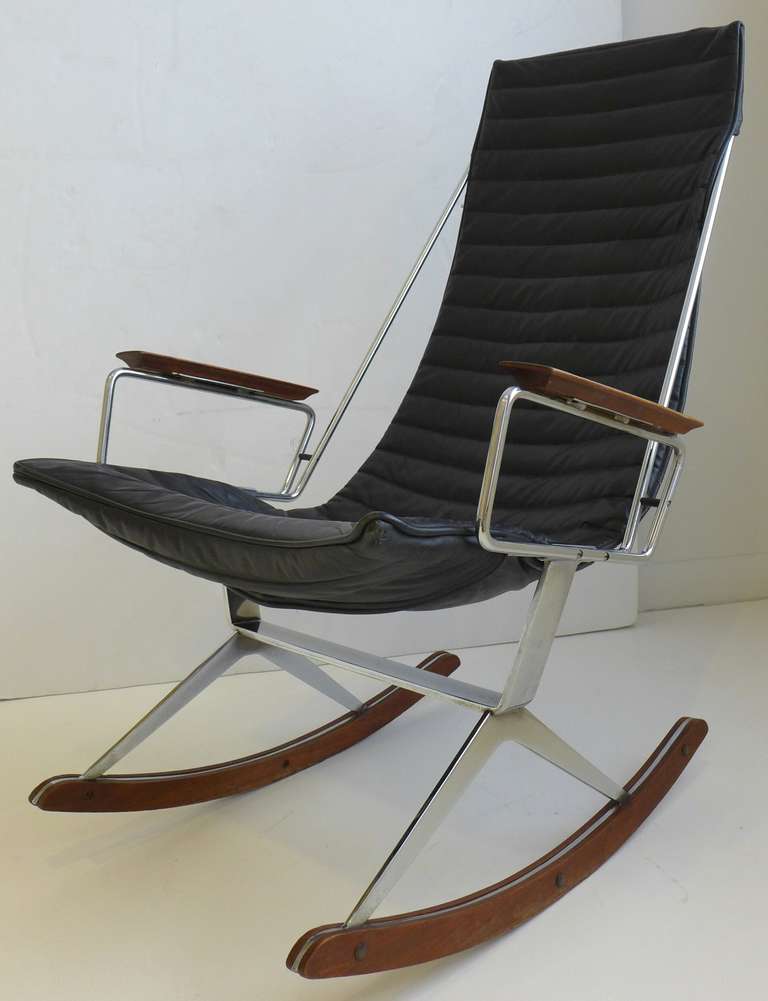 Sleek and photogenic rocking chair in chrome, walnut, and black naugahyde by California designer Gerald McCabe, made c.1960. Based on a chair McCabe designed for Case Study House #21 (1958), the rocker was offered during the mid-1960's by