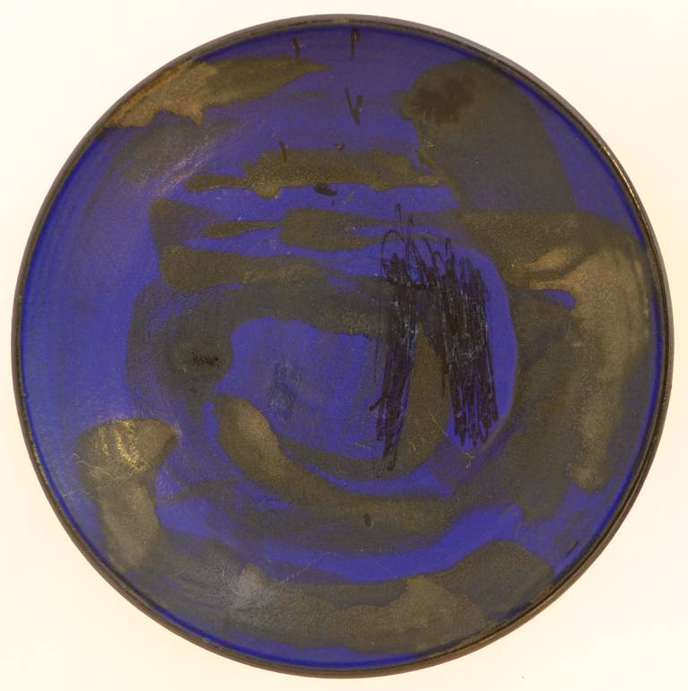Stoneware charger with painterly glaze by American master ceramist Toshiko Takaezu (1922-2011).  Steeped in both Asian and modernist American traditions (she studied with Maija Grotell at Cranbrook), Takaezu's body of work is in the permanent