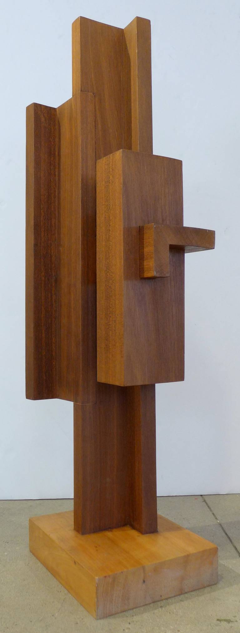 Constructivist sculpture of intersecting planes of wood by Dutch artist Johannes Hoog, dated 1982. A powerful and impressive work that references De Stijl architecture, tribal art, Brancusi, and Alexander Noll. The sculpture, which looks strikingly