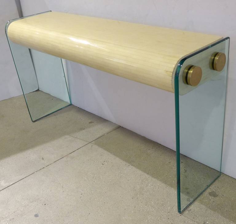 Bespoke console of tessellated stone with plate glass plinths and brass connecting disks. A glamorous piece with a nice mix of materials. Made by Oggetti, circa 1980s.