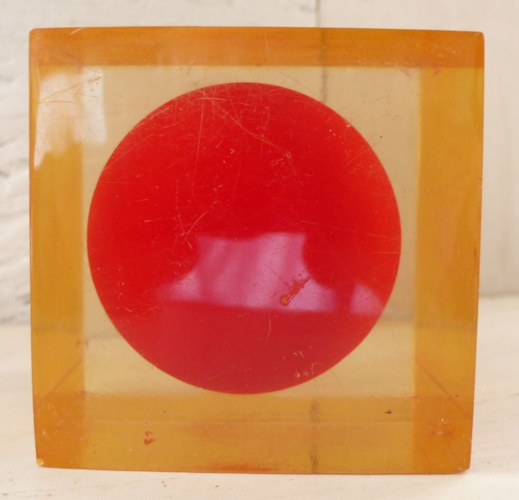 Amber lucite cube with vivid red ball in center by Enzo Mari for Danese, c. 1970's.<br />
Facets of cube refract and reflect the image of the ball in myriad ways, a few shown.  Second, clear cube SOLD.
