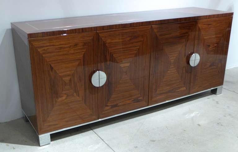 Luxe sideboard of highly figured (and polished) rosewood and chrome handmade in the Brienza region of Italy by the Masolo family--producers of the Giorgio Collection.  A discontinued model in a now-unavaliable wood, made in the 1990's.  In excellent