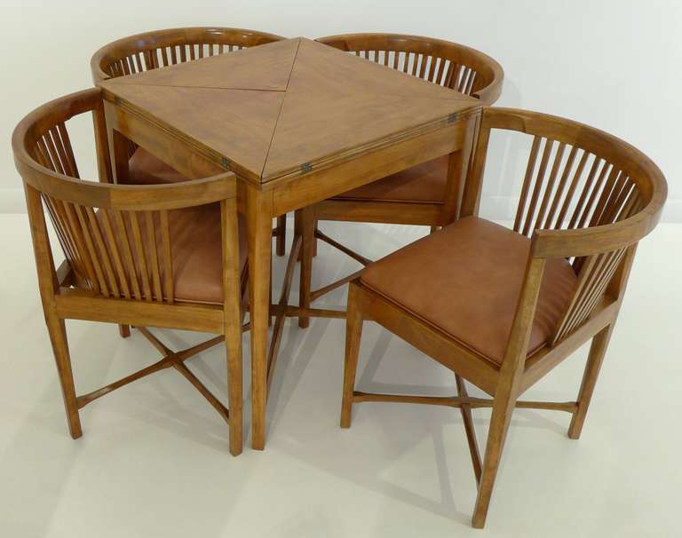 Beautifully crafted and detailed gaming or dining table set with four pull-in chairs, designed by Kaare Klint and made by the eminent Danish cabinet shop Rud. Rasmussen.  Of (likely Cuban) mahogany, with leather seats at some point replacing the