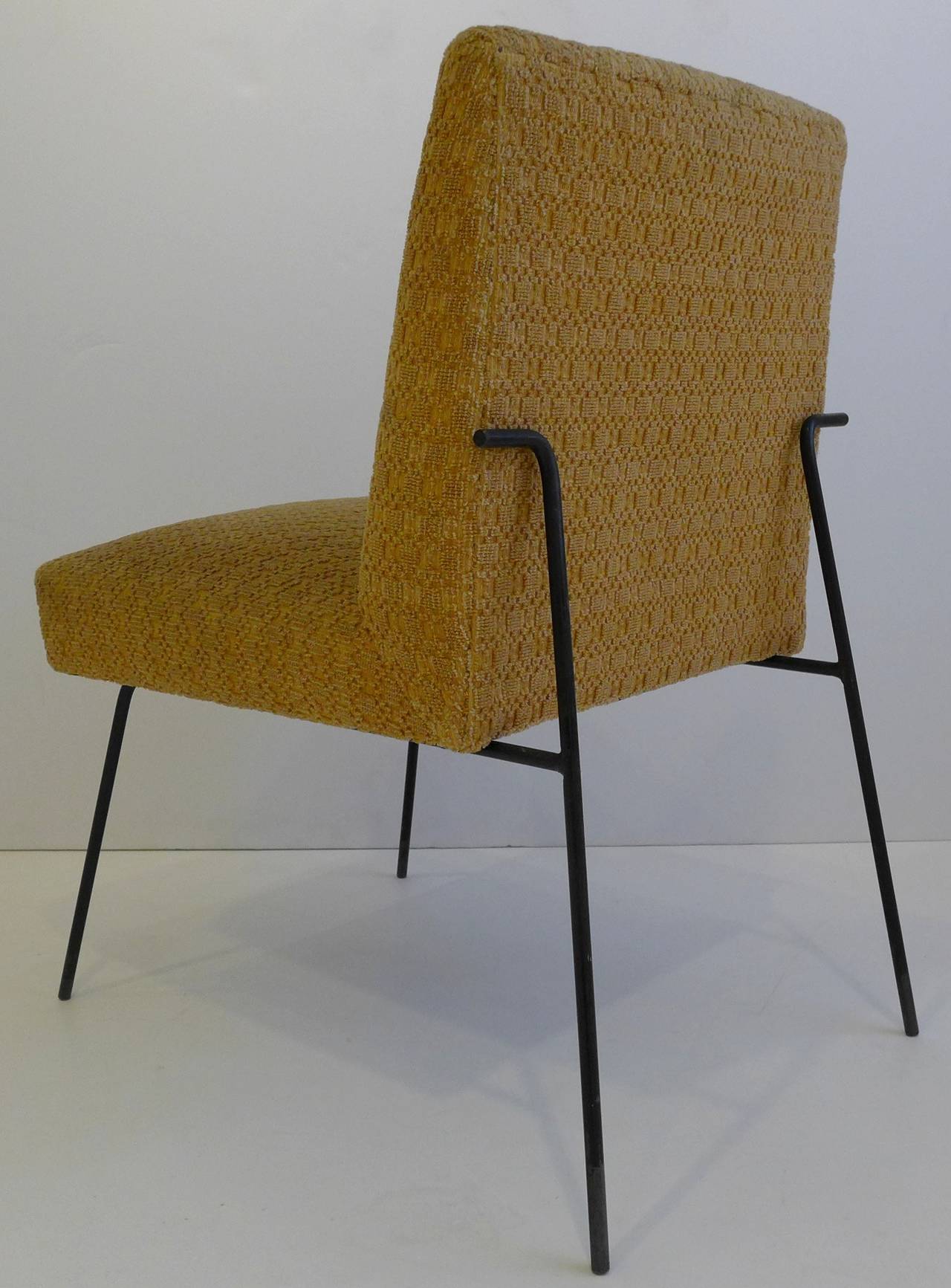 A rare and early chair design by one of America's great post-war designers, Milo Baughman. An elegant and sculptural use of wrought iron and spring-construction upholstery, produced by Pacific Iron Products, c. 1950. The right-turn elements at the
