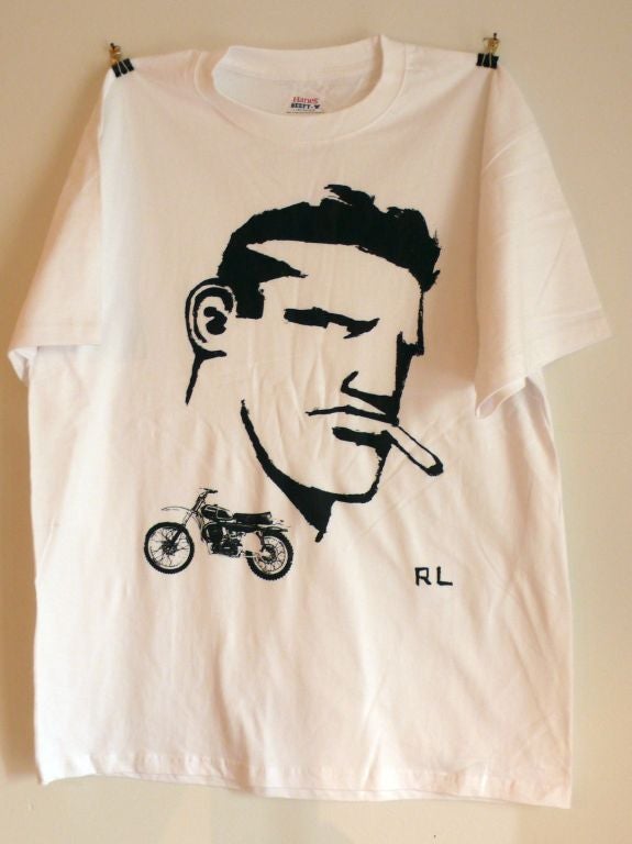 Hot off the presses!  Limited edition of 54 Robert Loughlin T-shirts, featuring the iconic brute, plus a motorcycle.  Two classics for the price of one.  Be the first on your block to sport one of these puppies. Guaranteed to improve your ability to