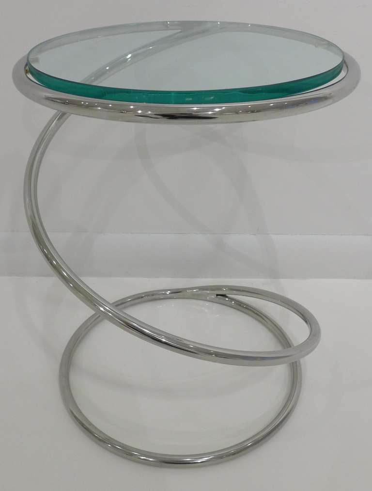 Coiled side table of chrome-plated tubular steel with a glass top, from the Pace Collection, c. 1970's.