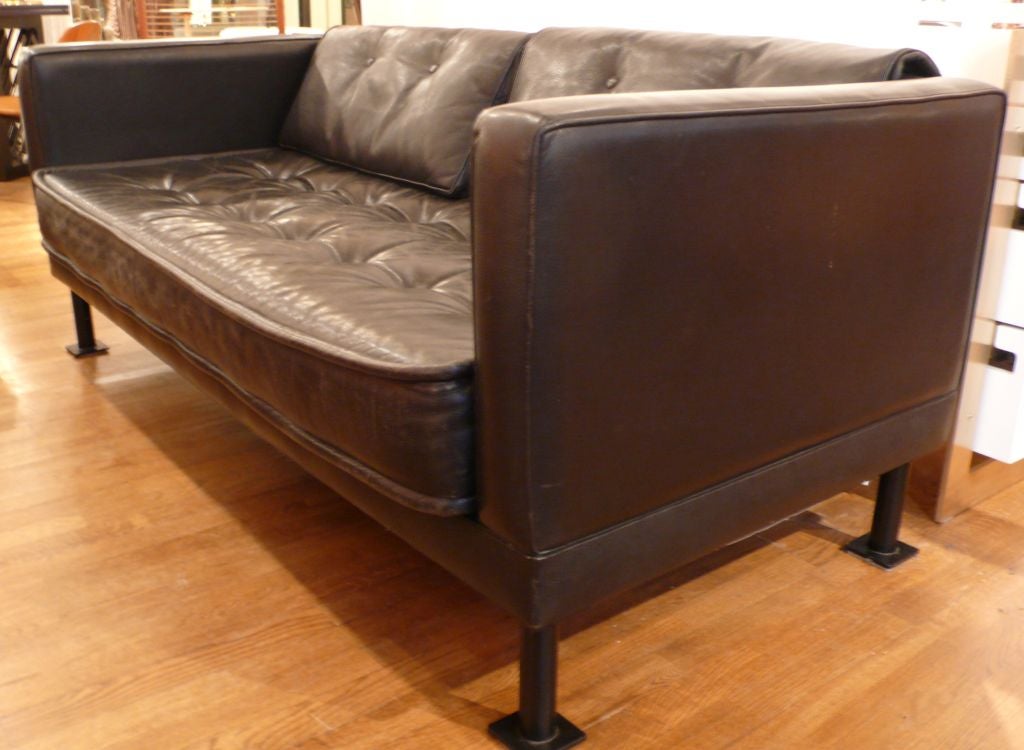 Leather sofa with steel legs and feet by Vietnamese-born designer Christian Duc.<br />
Produced in France, c. 1980's.  The throw-over back pads can be shifted to the ends of the sofa for lounging.