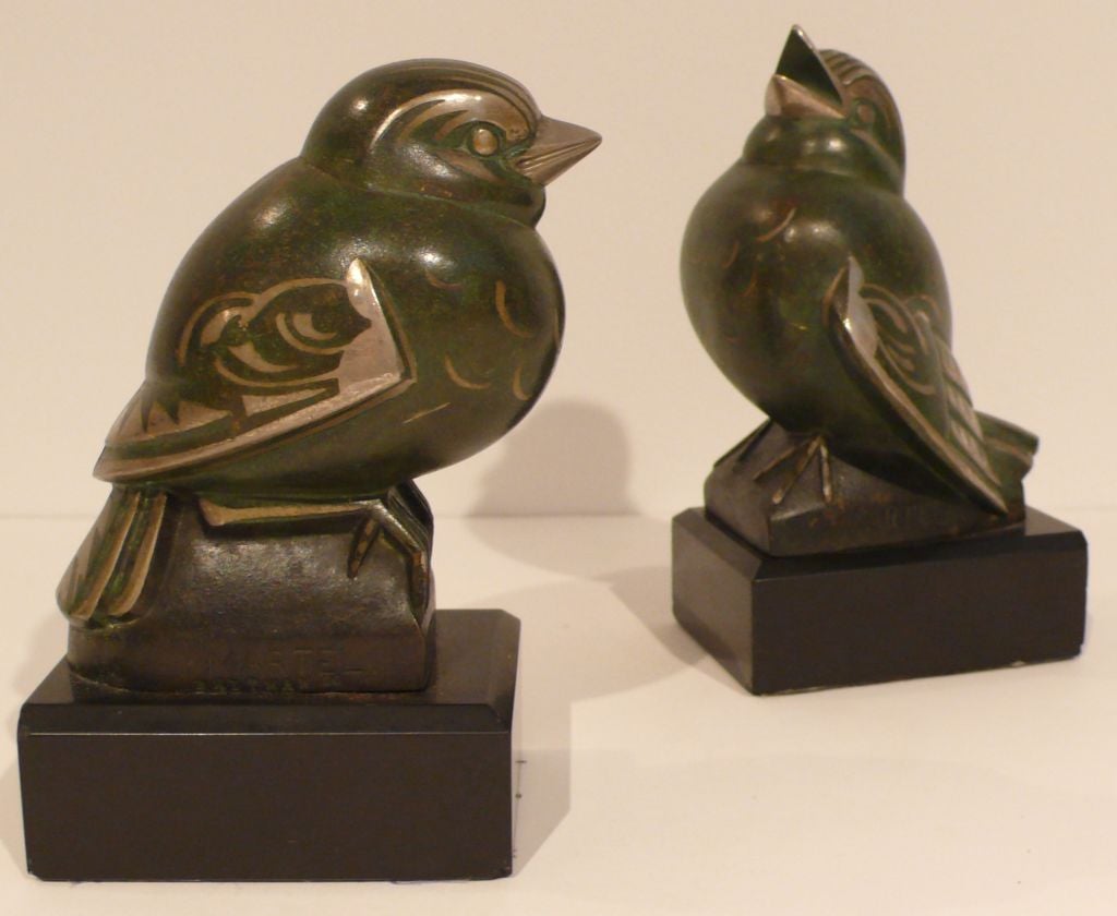 Pair of damascene and patinated bronze bird sculptures, different poses, by French deco masters and twin brothers Jan and Joel Martel (1896-1966). Produced c. 1925. Fully stamped in the molds with makers' marks and the numbers 51 and 56. 