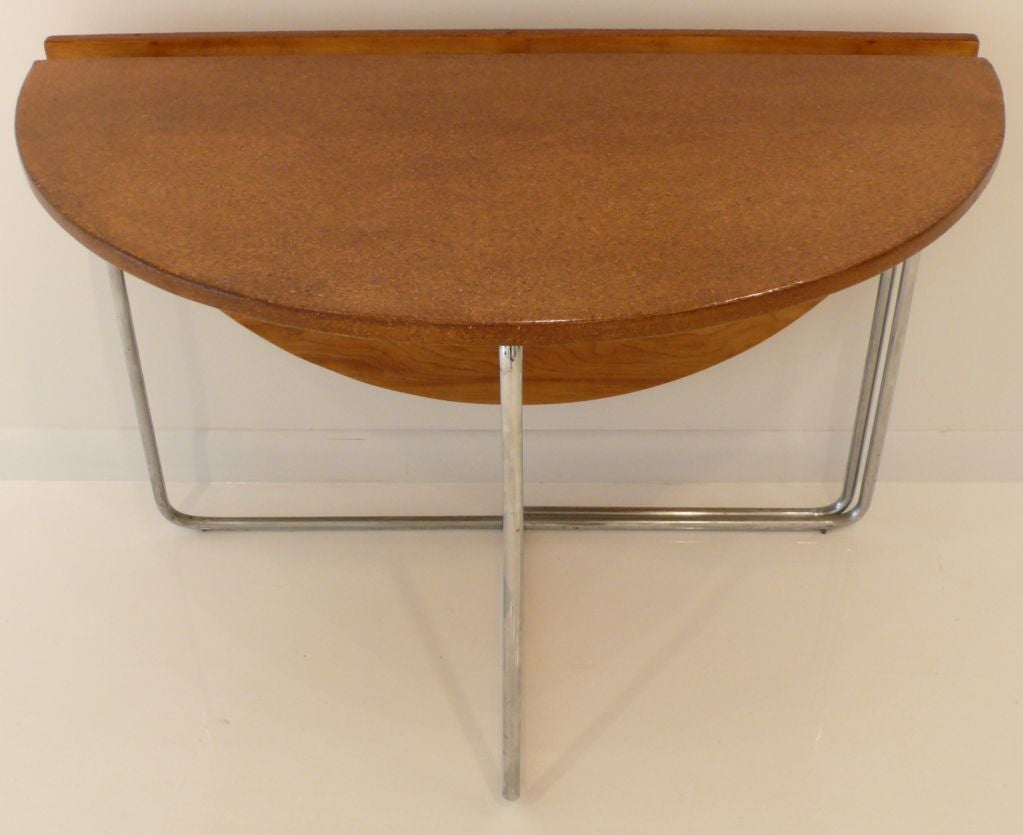 Refined tubular steel folding table with cork top and walnut underneath.  Beautiful proportions, milling, and details.  Brought back to NYC from France c. 1930 by American expatriate artist couple.  Of European origin, probably French, Swiss, or