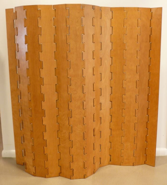 Rare folding cut plywood screen, one side birch, the other mahogany, with a jigsaw puzzle pattern by New York City designer and entrepreneur Clifford Pascoe, c. 1949.  As Artek-Pascoe, Pascoe was an early importer of Aalto furniture.  HIs late 40's