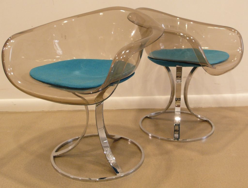 Interesting pair of tulip-shaped Lucite and chrome armchairs by British designer Peter Hoyte, produced circa 1968. With original upholstery, which is applied underneath the outside of the chair, as well as in the seat. Price is for both. Retains