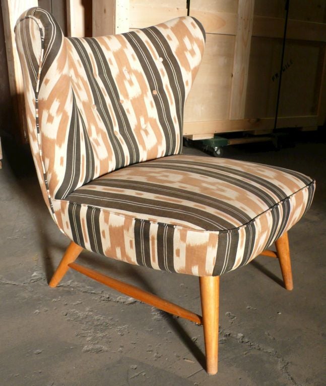 Early Knoll chair designed by Elias Svedberg.  A modernist wing chair, substantial and comfortable.  Birch legs with a vintage, but not original fabric.  Materials are in good shape but for a water stain to the seat of the chair, pictured.  Pricing