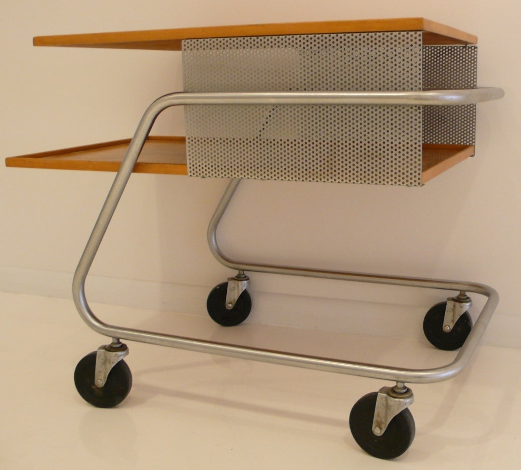 A Franziska Hosken design melding the academic linearity of the Bauhaus with the familiar lines of an American shopping cart.  The Hosken cart gained wide recognition in contemporary design literature, including appearances in Furniture Forum,