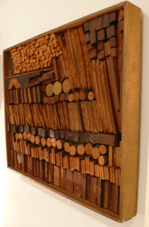 Abstract wall relief of sawn, stained, and collaged wood by Lithuanian-born American artist Josef Twirbutt.  A practicing architect as well as artist, Twirbutt arrived in New York City in 1959 and plugged into the Village art scene.  He created his