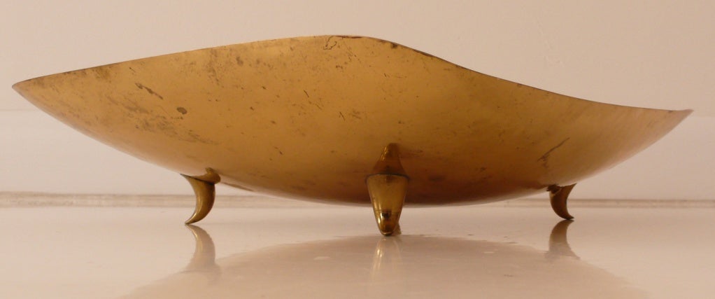 Large, hand-hammered brass bowl with hounds-tooth feet by Karl Hagenauer for the Hagenauer Werkstatte, c. 1950. Karl joined the family business in 1919, remaining until his death in 1956.  This elegant, rectangular bowl with upturned, rounded edges