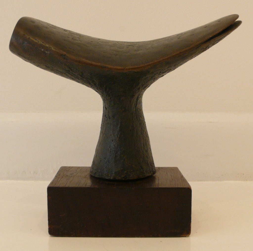 Solidly massed abstract cast bronze sculpture on original wood base by San Diego artist Jack Boyd, executed c. 1968.  Boyd, a self-trained artist in a variety of media, became a member of San Diego's prestigious Allied Craftsmen in the 1960's.  His