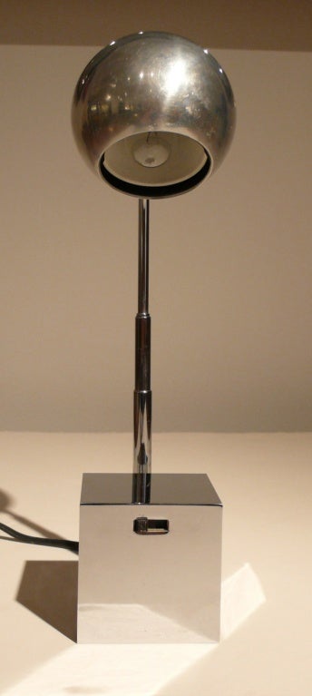 Lytegem lamp designed by Michael Lax and produced in Japan for Lightolier, c. 1960's.  Chrome base with a spherical, swiveling chrome light on adjustable telescoping arm.  Height ranges from 6.5