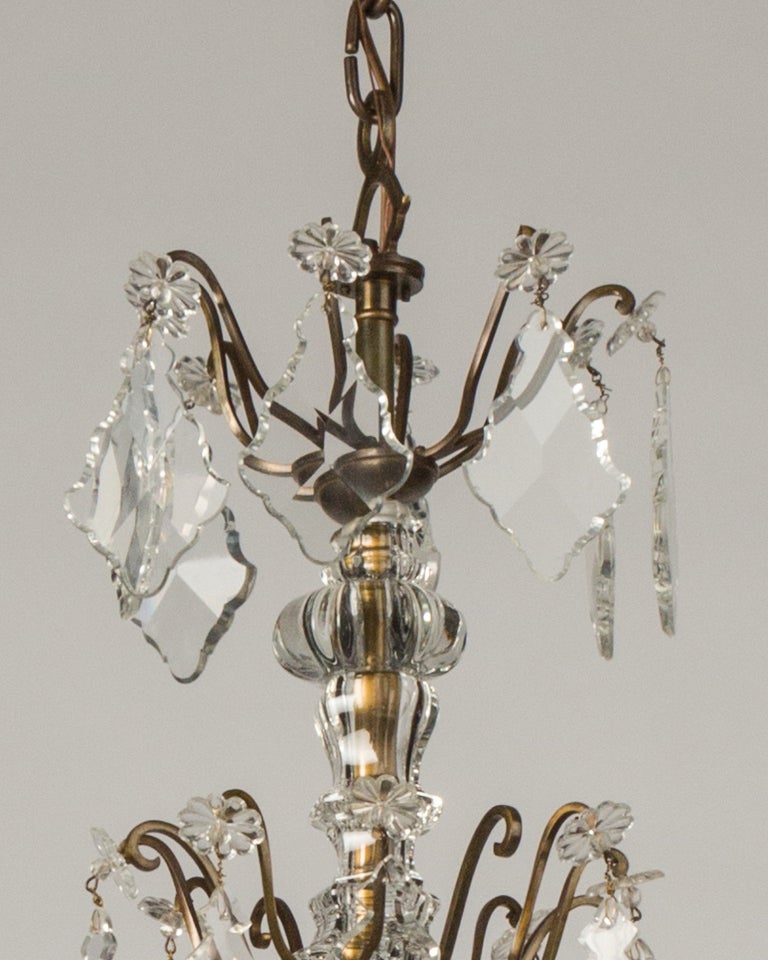 20th Century Eight Arm Brass and Glass Chandelier with Four Tiers of Faceted Crystal Prisms
