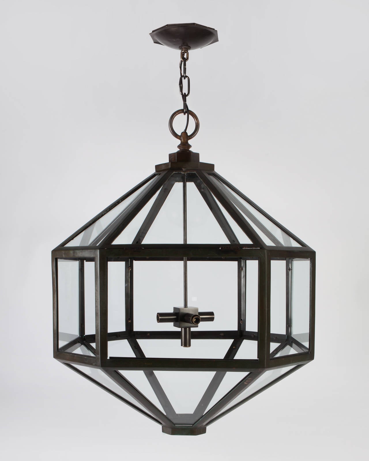 AHL3884

Circa 1920
A large antique icosikaitetragonal lantern in its original aged brass finish, with a modern lamping cluster of our devising. Glazed with clear glass panels.

Dimensions:
Current height: 70