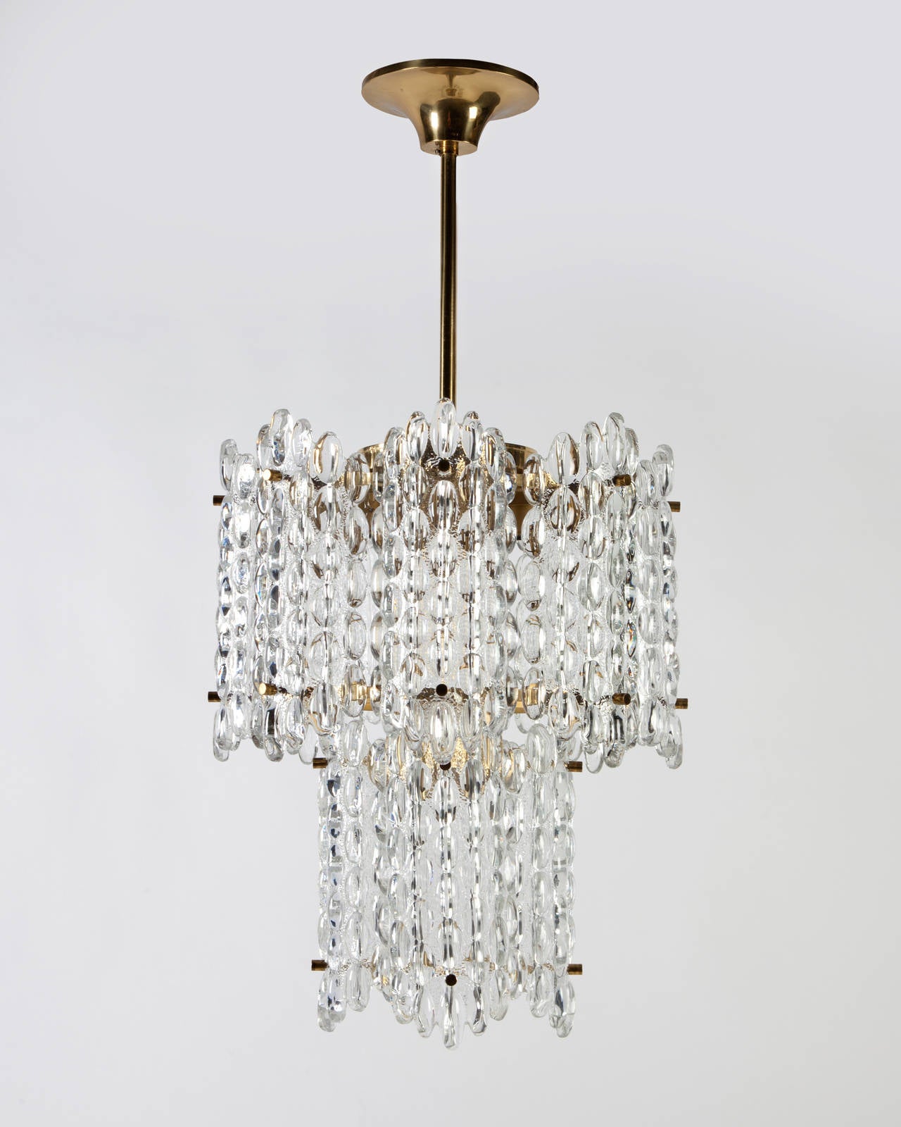 AHL3871

Circa 1950
A vintage chandelier with two tiers of textured curved glass panels on a brass frame. Designed by Carl Fagerlund for the Swedish glassmaker Orrefors. Due to the antique nature of this fixture, there may be some nicks or
