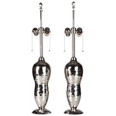 A pair of faceted nickel lamps
